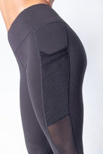 Load image into Gallery viewer, Shakolo mid waist leggings in black side view close up with mesh side